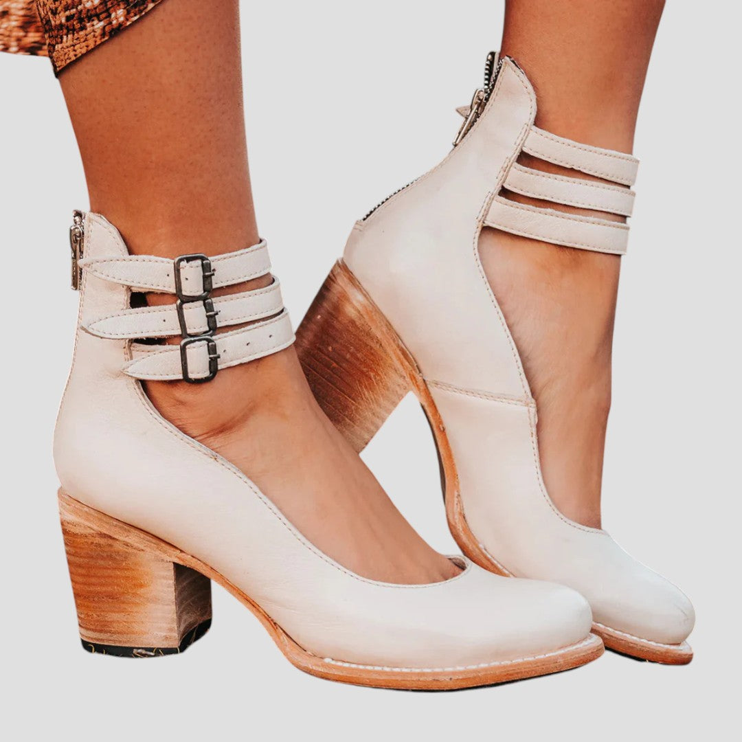 Sophisticated women's closed toe block heels with adjustable buckle strap, versatile for any elegant occasion.
