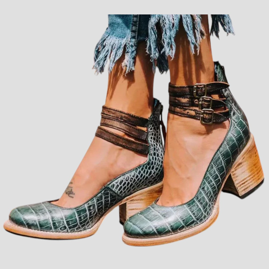 Women's comfortable closed toe block heels with a sleek buckle strap, blending classic style and ease.