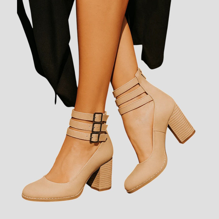 Fashionable women's closed toe block heels, designed with a secure buckle strap and sturdy heel for day-long wear.