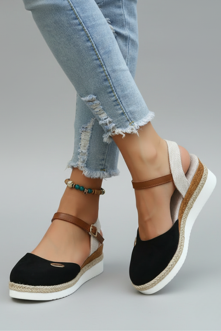 Women's casual closed-toe espadrille sandals featuring a jute platform sole & secure heel strap for summer.