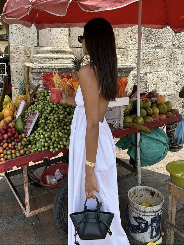 Women's elegant open back maxi dress, sleeveless. Perfect for summer, beach, and casual outings.