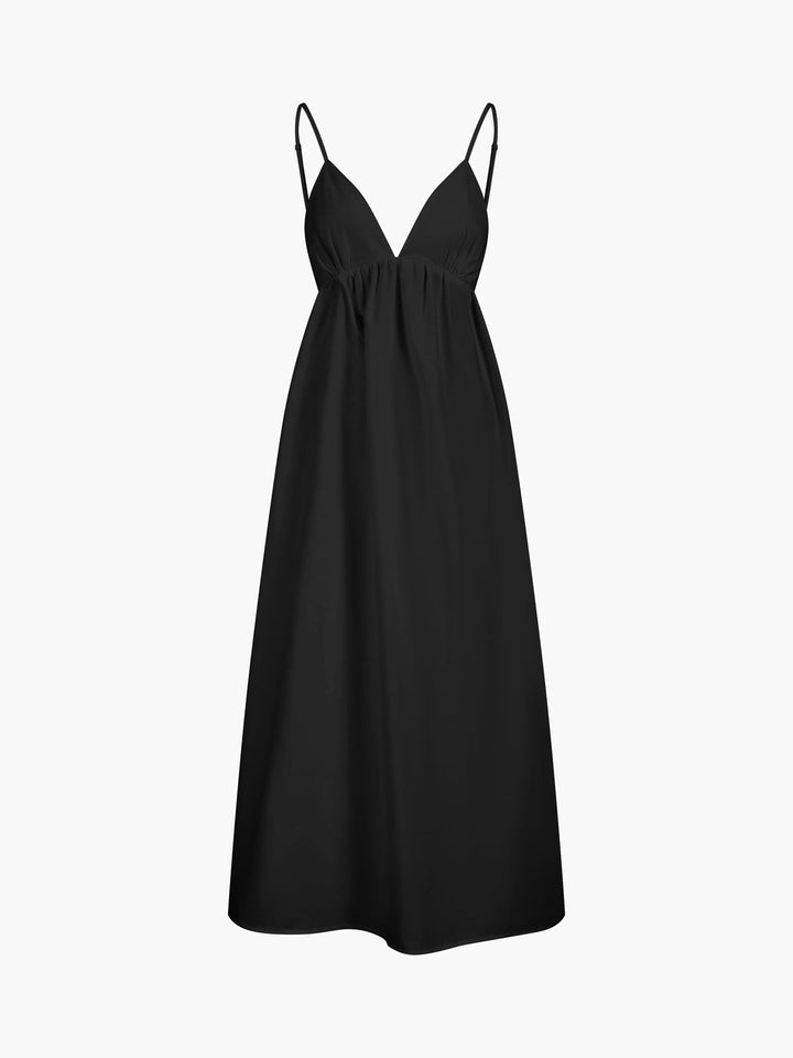 Stylish women's open back maxi dress. V-neck, sleeveless, flowy. Perfect for summer beach days.