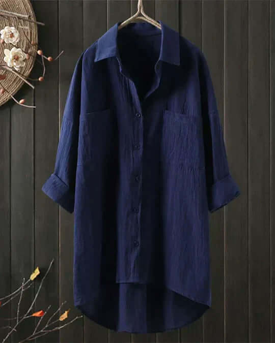Relaxed fit women's collared blouse, button-up with double pockets & roll tab sleeves, ideal for spring fashion.