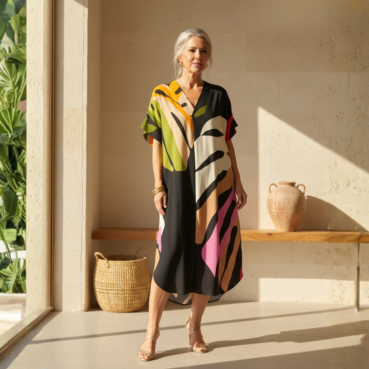 Women's colorful abstract print V-neck shift dress, short sleeve, relaxed fit for casual summer fashion.