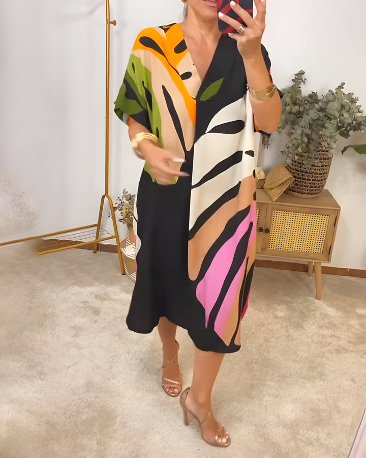 Effortless women's abstract print summer dress, V-neck, short sleeve, relaxed fit for everyday style.