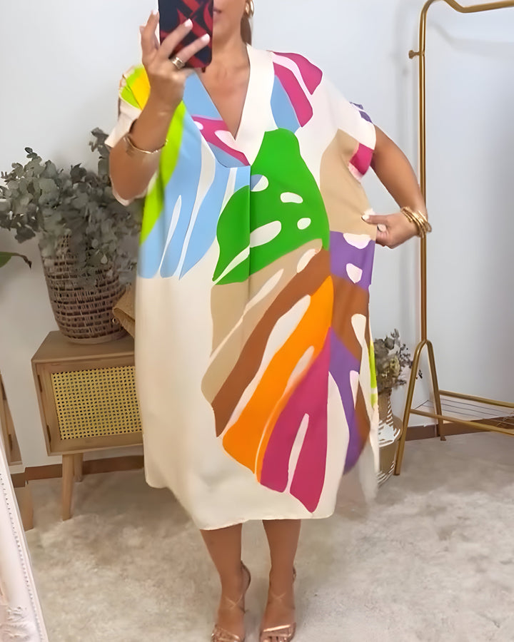 Vibrant abstract print women's V-neck shift dress, relaxed fit, short sleeve, ideal for summer fashion.
