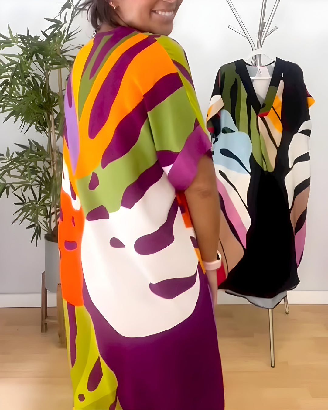 Women's short sleeve abstract print shift dress, V-neck, comfortable relaxed fit for casual outings.