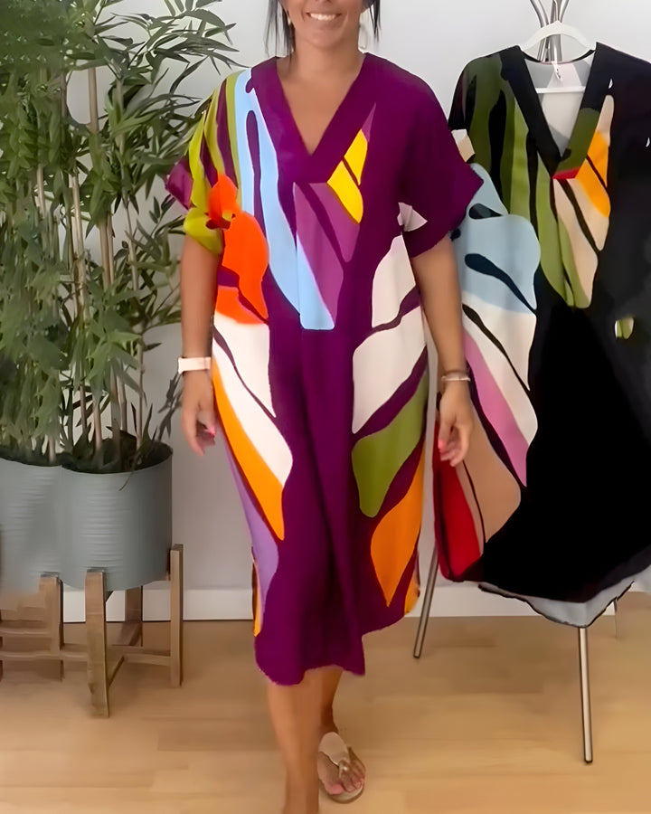 Elegant yet casual women's V-neck shift dress, featuring a bold abstract print and short sleeves.