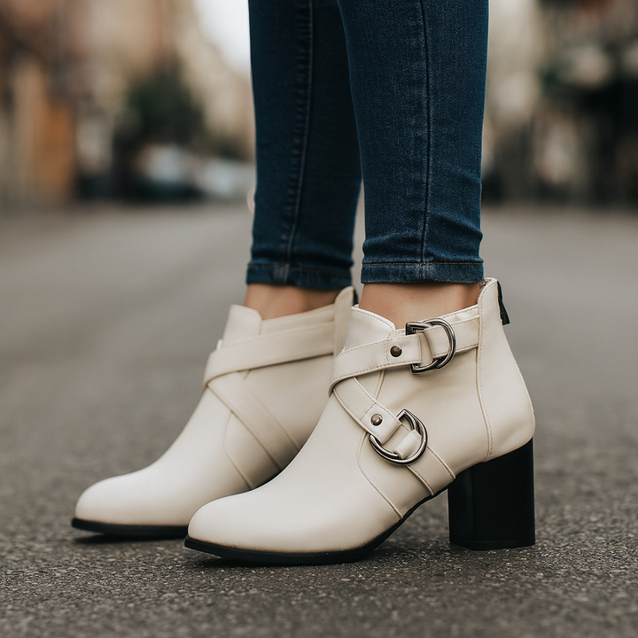 Close-up of a women's comfort buckle ankle bootie, showing buckle detail and texture