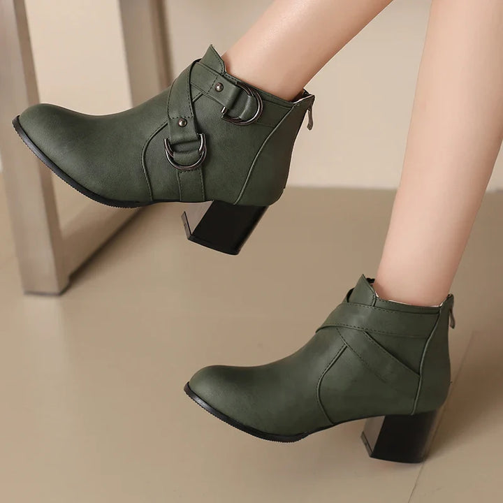 Front view of women's comfort buckle ankle boot, sleek design for versatile wear