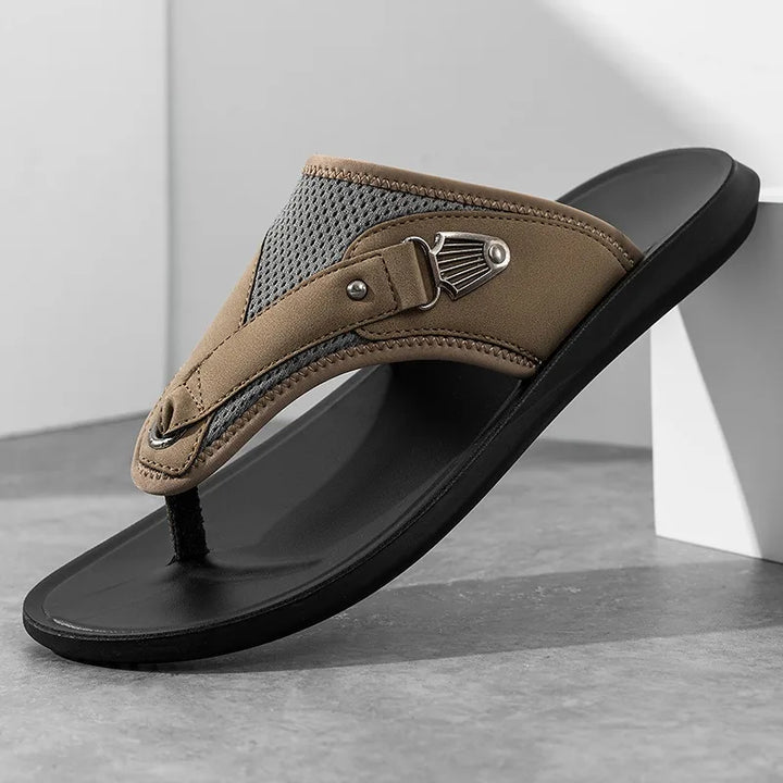 Top-down view of women's flat sandals, highlighting the comfort buckles and breathable mesh design.