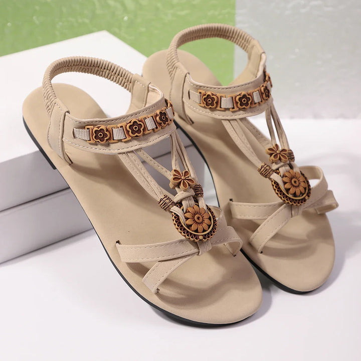 Walking shot: Women's Comfort Floral Accent Slip-On Sandals, demonstrating flexibility and support