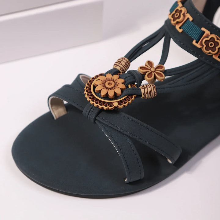 Women's cushioned slip-on sandals with a prominent floral design, suitable for any casual outing