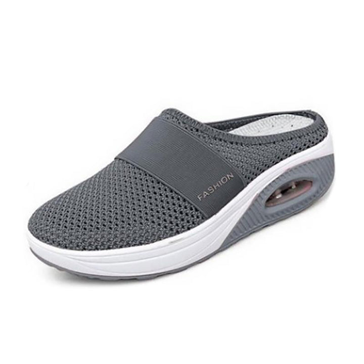 Comfort-focused women's flat sandals with soft mesh and supportive heel