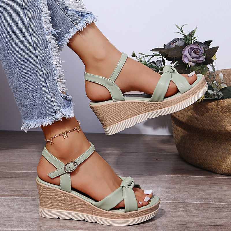 Women's comfortable wedge sandals with secure ankle strap & elevated platform sole.
