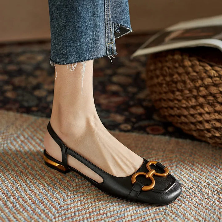 Comfortable women's dress shoes: slingback flats with sophisticated chain embellishment.