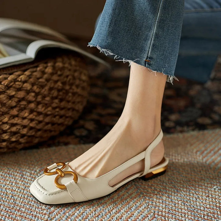 Detail shot of the slingback strap and chain on women's comfort orthopedic flats.