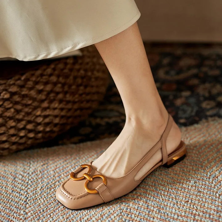 Diverse color options for women's comfort slingback flats, all with elegant chain detail.