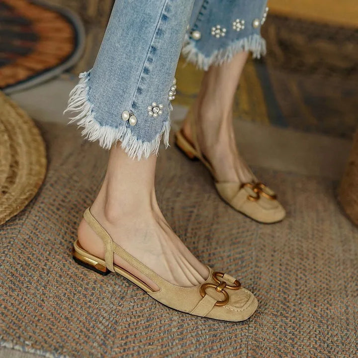 Pair of womens comfort slingback flats with chain detail, ready for effortless everyday wear.