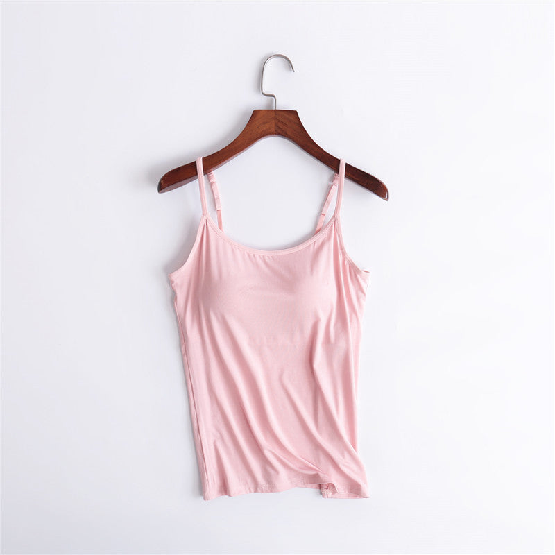 Stylized flat lay of a women's comfort tank top, built-in bra, folded, ready for wear