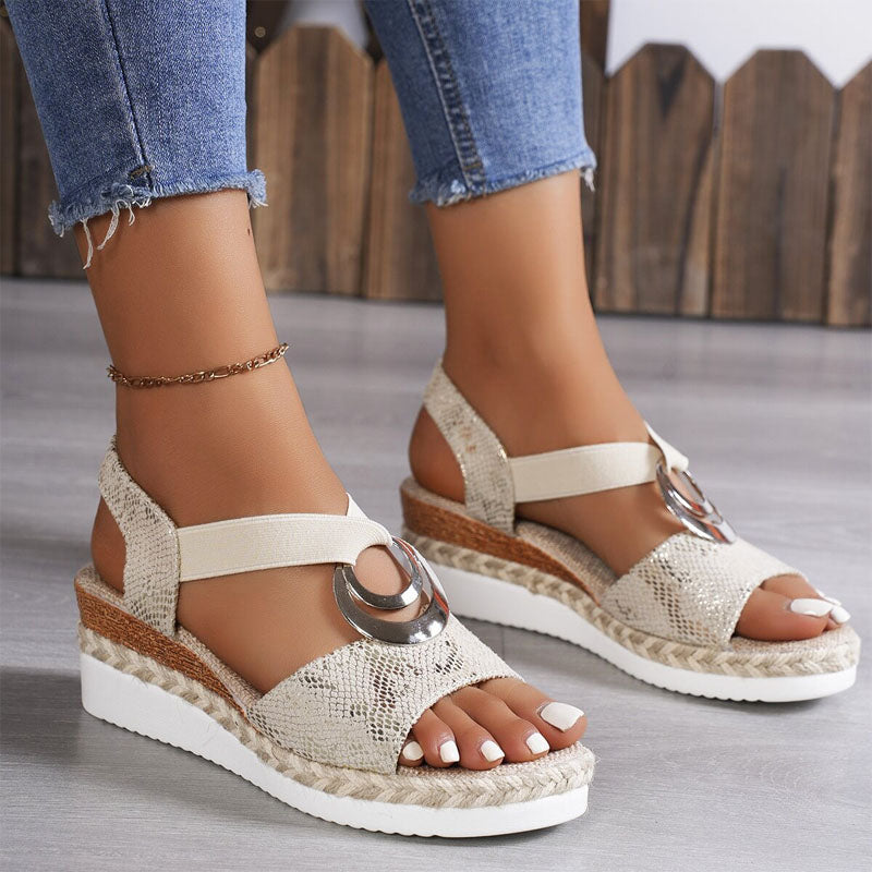 Chic women's open-toe wedge sandals featuring elastic straps & comfortable platform. Perfect for summer walks.