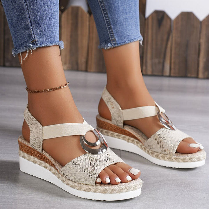 Chic women's open-toe wedge sandals featuring elastic straps & comfortable platform. Perfect for summer walks.