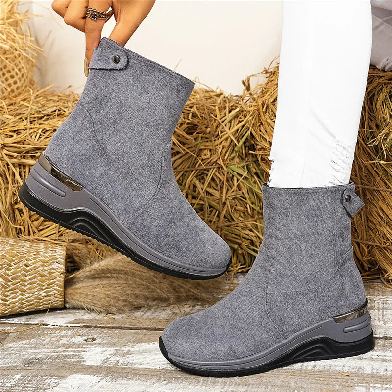 Close-up of the elegant hardware on women's zip ankle boots, a touch of fall fashion.