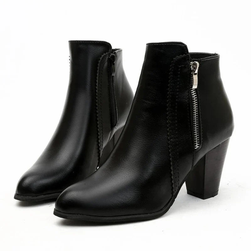 Side view of women's comfortable ankle boots, highlighting the scalloped detailing and practical side zipper.