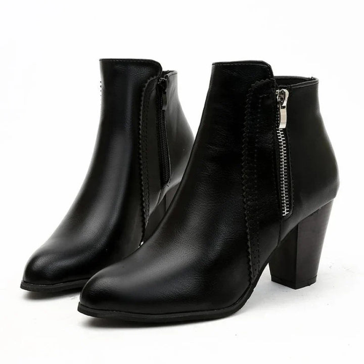 Side view of women's comfortable ankle boots, highlighting the scalloped detailing and practical side zipper.