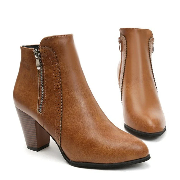 Fashionable women's ankle boots with a distinctive scalloped edge, designed for comfort and everyday use.