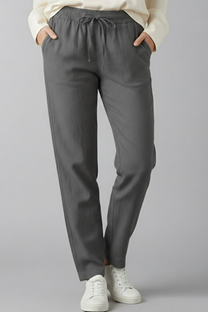 Modern women's ankle trousers with a relaxed fit, elastic waist, and side pockets for comfort.