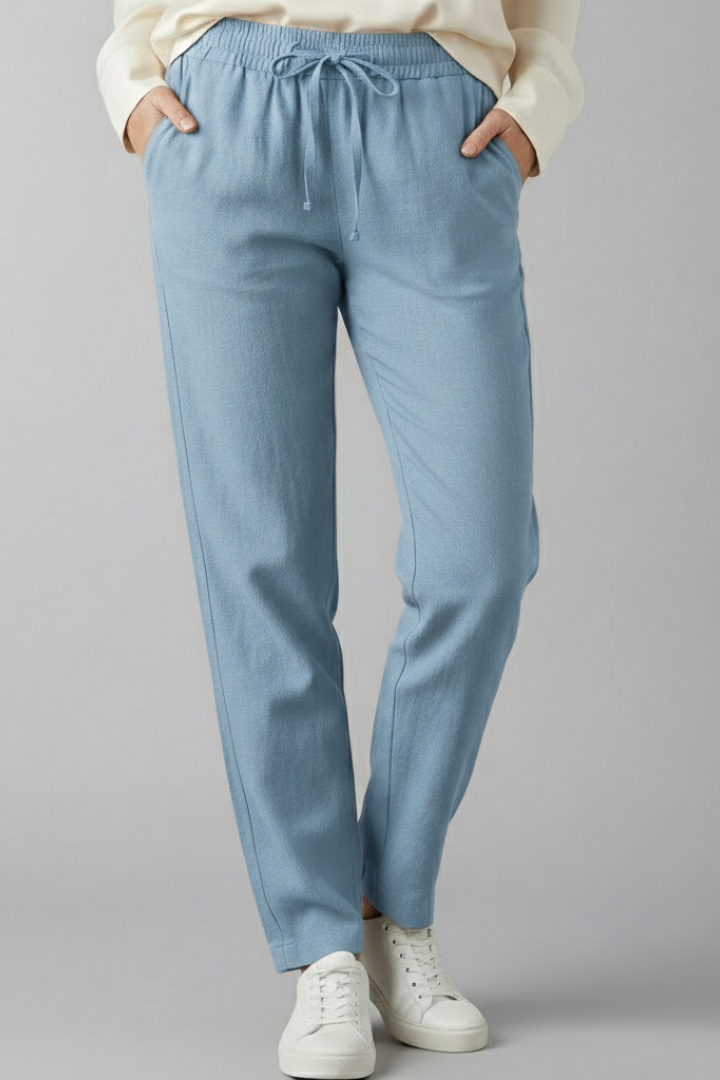 Versatile women's comfortable trousers, ankle length, featuring an elastic waist and functional pockets.