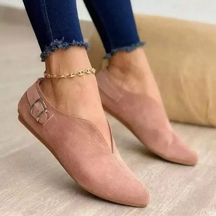 Pair of women's fashion flats with decorative buckles, offering both style and comfort
