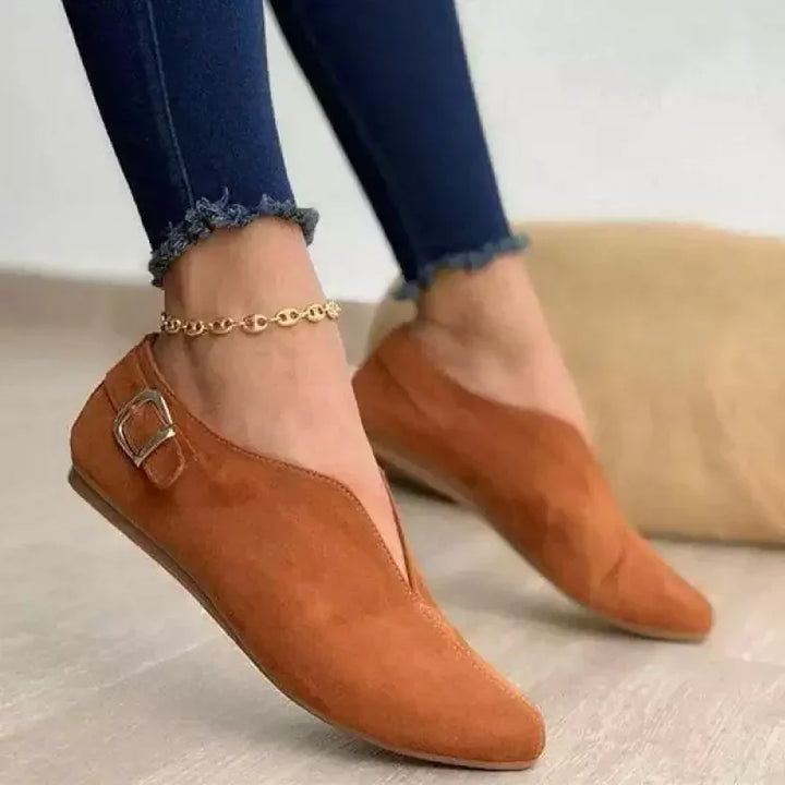 Stylish women's flats, featuring a prominent buckle detail and designed for all-day comfort