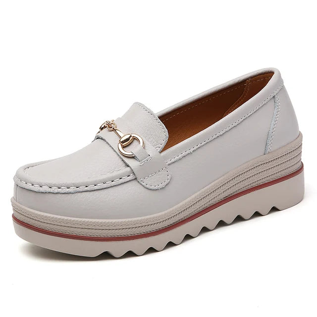 Comfortable black platform loafers for women, complete with a fashionable chain