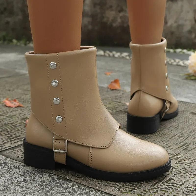 Women's winter boots: black vegan leather ankle style, emphasizing comfort and casual elegance.