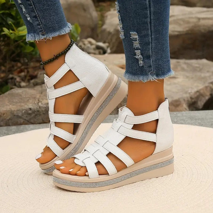 Woman walking in comfortable black wedge sandals, perfect for daily summer casual wear.