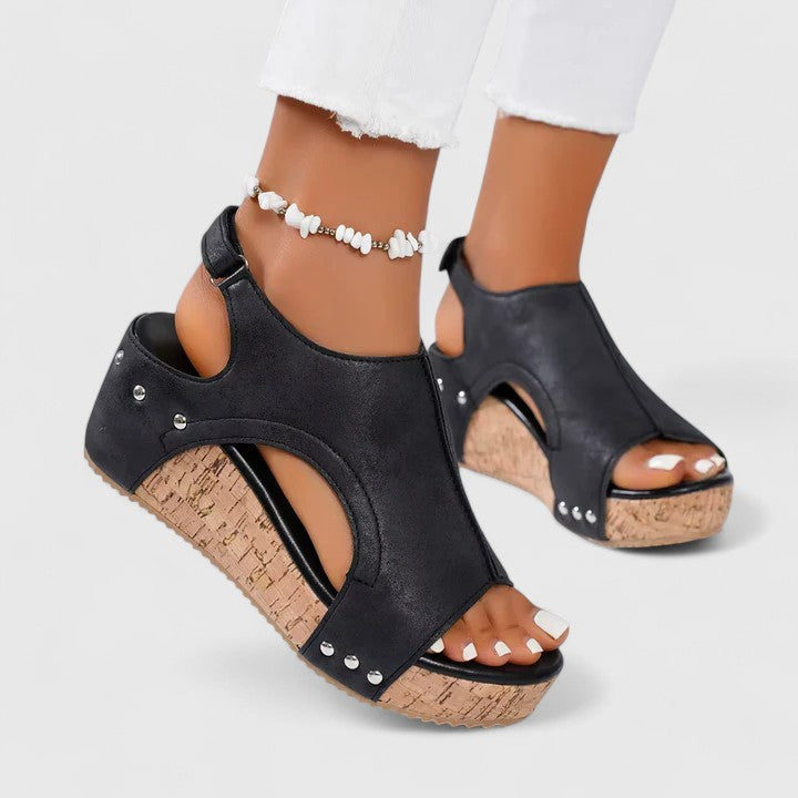 Chic women's wedge sandals in brown leather, offering all-day comfort & support. Perfect versatile summer footwear.
