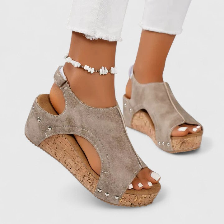 Comfortable women's navy wedge sandals for casual wear. Excellent arch support and stylish design for summer walking.