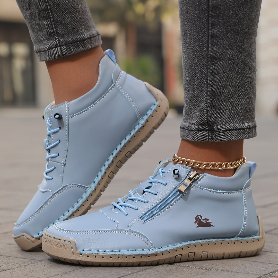 Pair of women's comfortable walking sneakers with a convenient zip-up design, ideal for spring fashion.