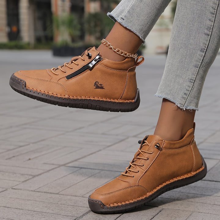 Side view of women's comfortable zip-up sneakers, highlighting the cushioned sole for extended walks.