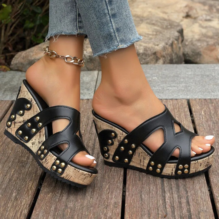 Stylish women's wedge sandals with a studded platform, offering both comfort and chic elegance for summer.
