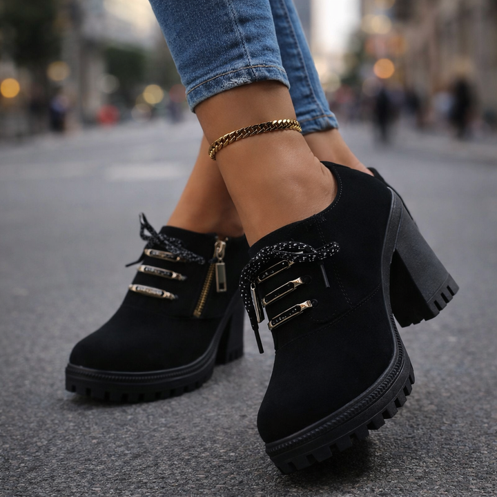 Fashionable black block heel boots for women, featuring a comfortable design and lace-up front.