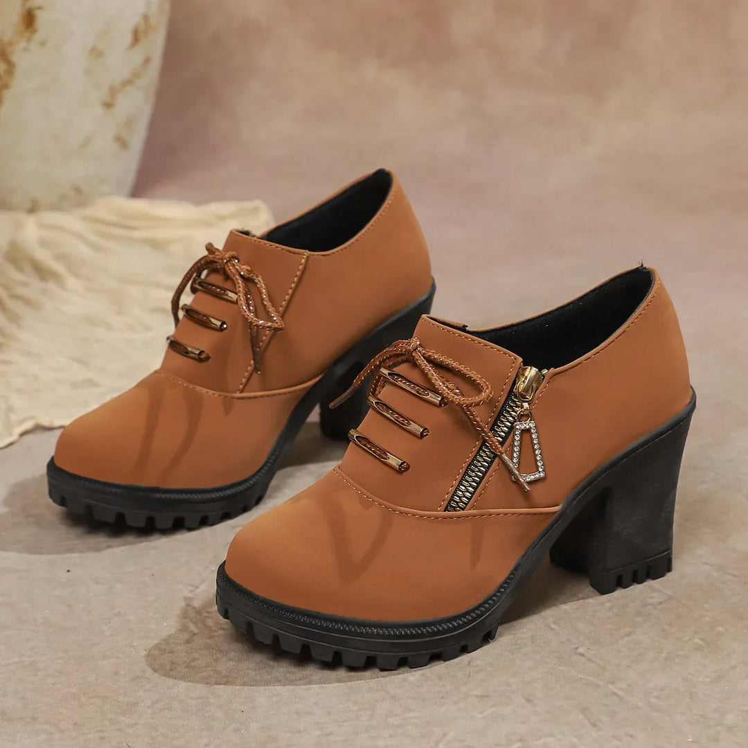 Orthopedic-friendly women's block heel boots in a versatile brown, offering comfort and style.