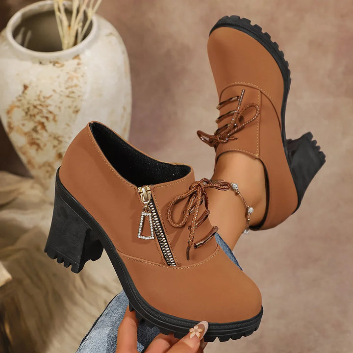 Side view of women's comfortable brown block heel boots, showcasing the durable sole and laces.