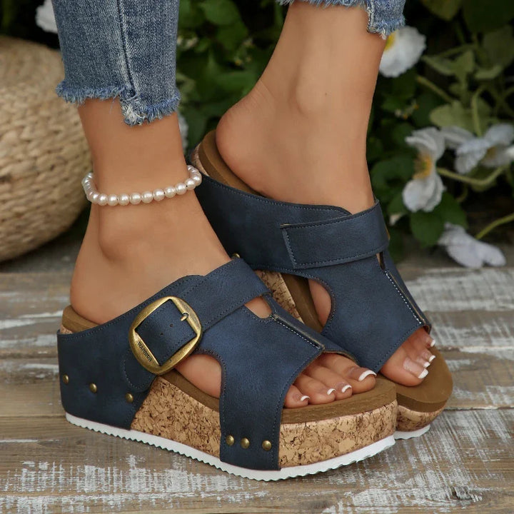 Orthopedic women's slides featuring adjustable buckles and a supportive cork platform for comfort