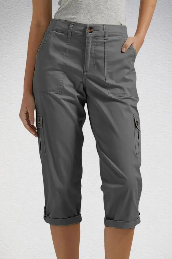 Versatile women's cropped cargo pants styled with a casual top, perfect for summer outings.