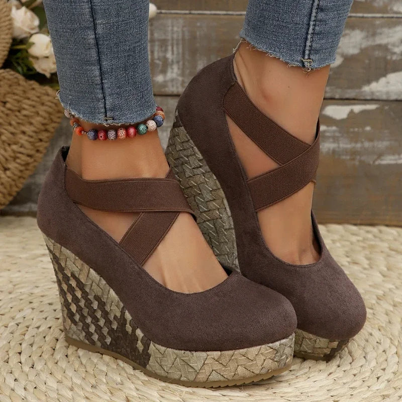Model wearing women's comfortable cross strap wedge sandals; supportive fashion for summer shoes.