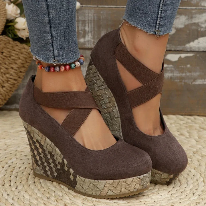 Model wearing women's comfortable cross strap wedge sandals; supportive fashion for summer shoes.