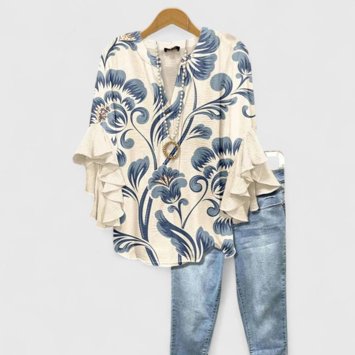 Women's comfortable floral print blouse with elegant ruffle sleeves. Perfect for summer casual chic.